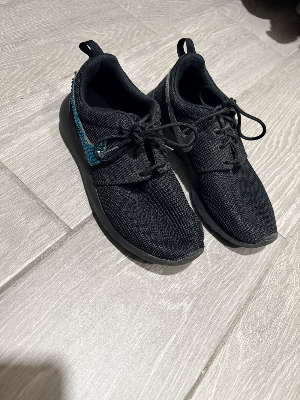 Nike Women's Black Knit Athletic Shoes with Teal Accent